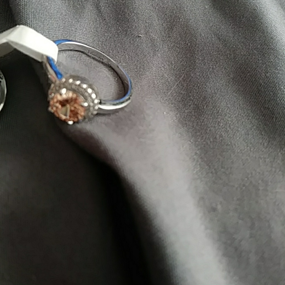 Silver ring with peach colored silver stone